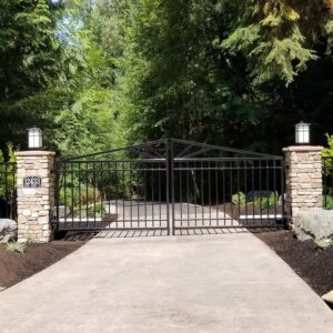 Closed, Woodinville Steel Driveway Gate, Stamped Concrete Drive, With Stone-Faced Pillars