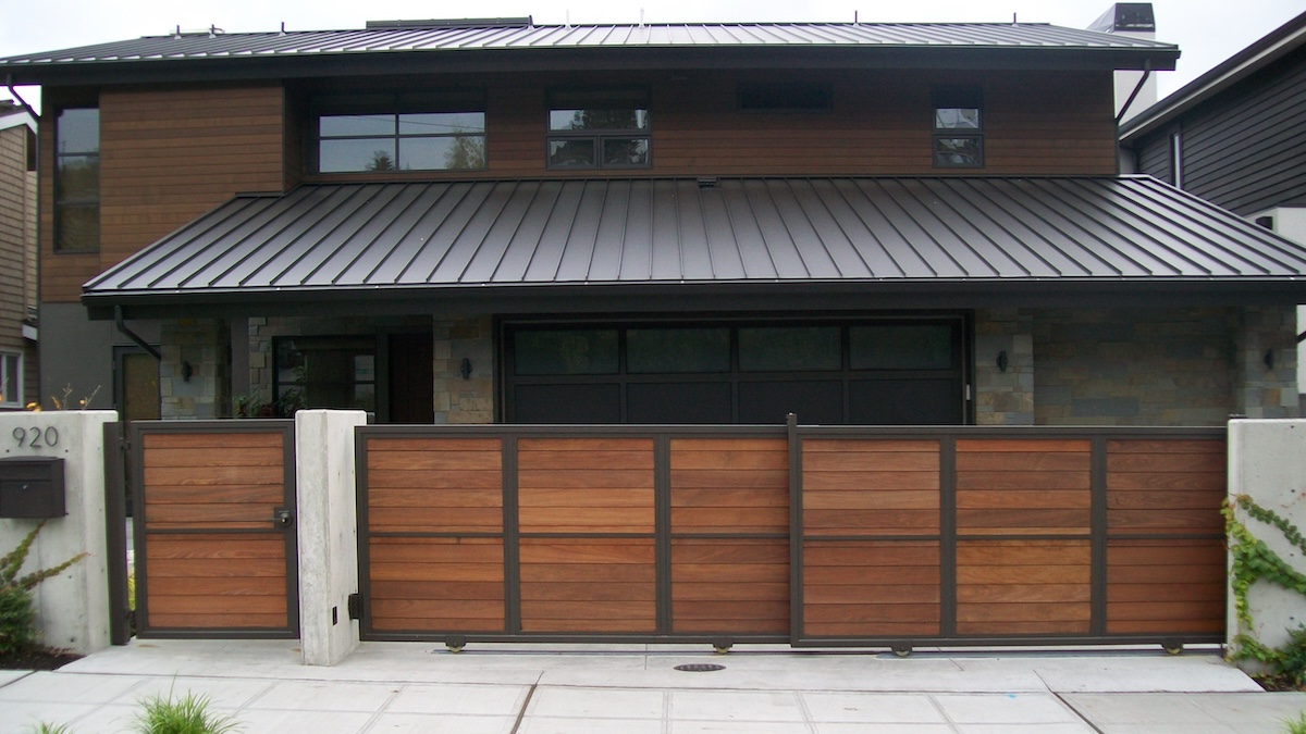 A Cement Wall Separates Pedestrian And Driveway Gates - Leschi, Seattle, WA